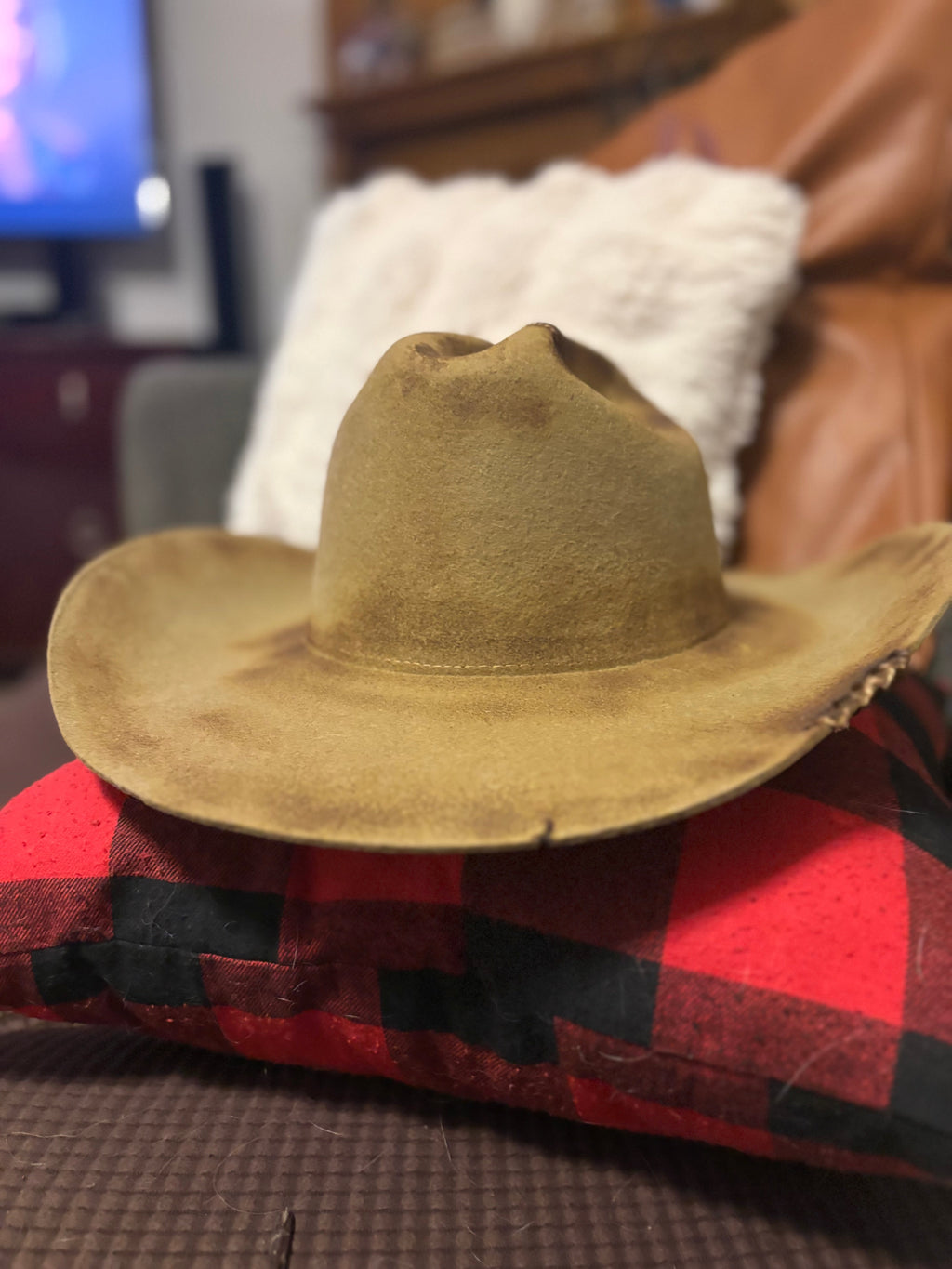 Tan felt cowboy hat — front view showing brim and crown detail