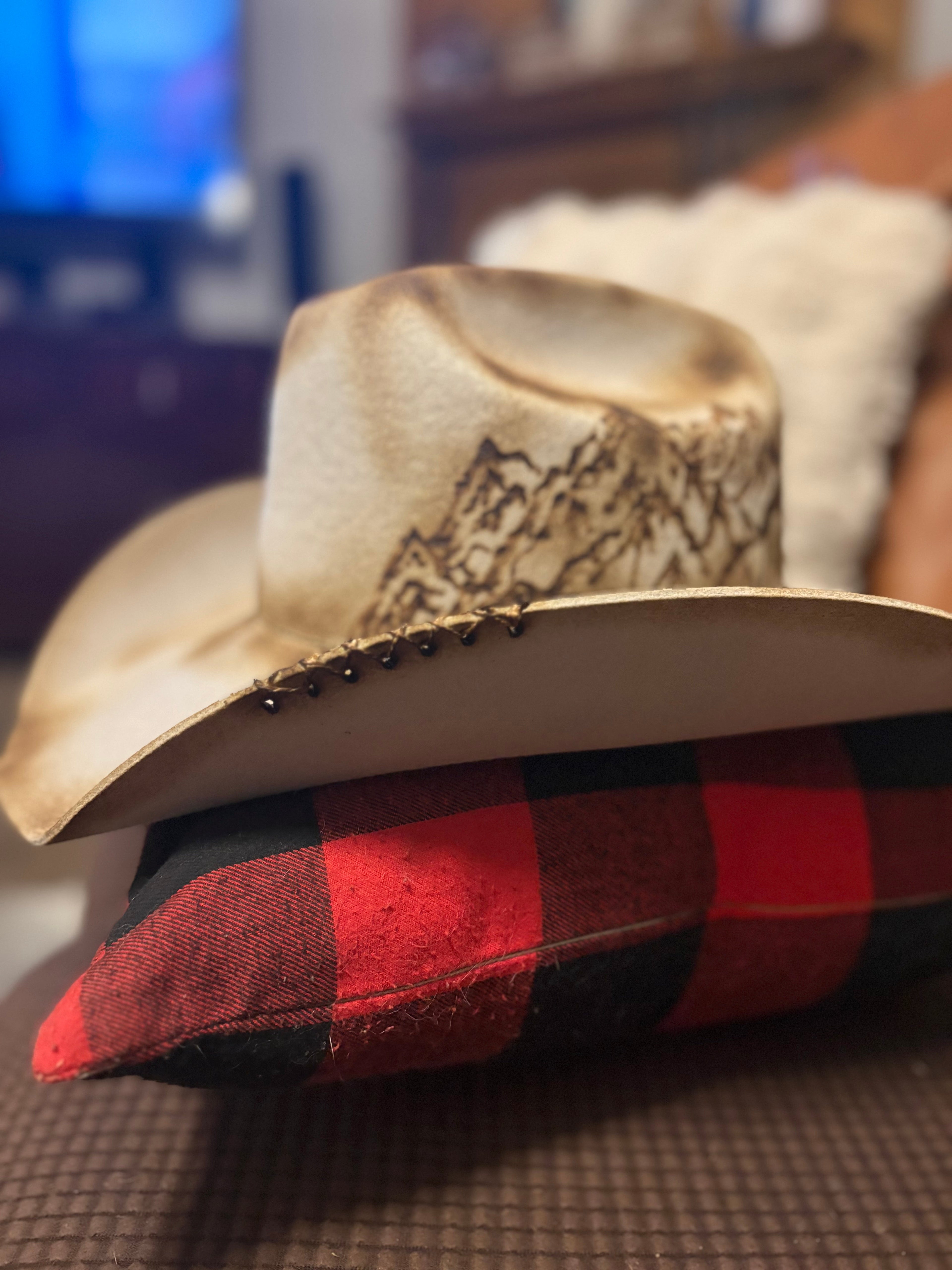 Silverbelly felt cowboy hat with pyrography mountain range detailing, front three-quarter view