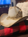 Silverbelly felt cowboy hat with pyrography mountain range detailing, side view showing brim stitching